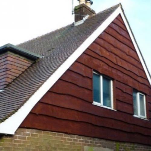 Как украсить фронтон дома. Материалы для обшивки стен чердака 07