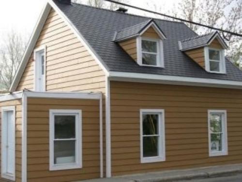 Как украсить фронтон дома. Материалы для обшивки стен чердака 10